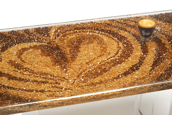 Coffee Table, 2015. Coffee beans roasted to different temperatures to create different colours, then cast in resin. Perspex casing and glass top. 90 x 50 x 41cm.
